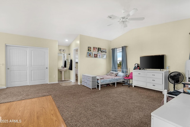 interior space featuring vaulted ceiling, baseboards, and ceiling fan