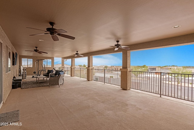 view of patio / terrace featuring ceiling fan and fence