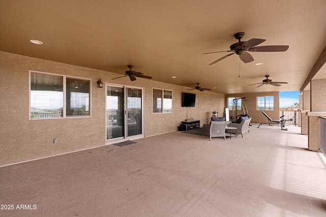 view of patio / terrace with an outdoor living space and ceiling fan