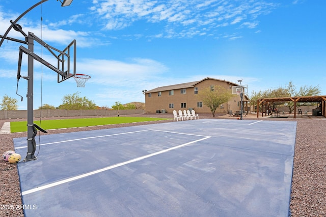 view of sport court featuring community basketball court and fence