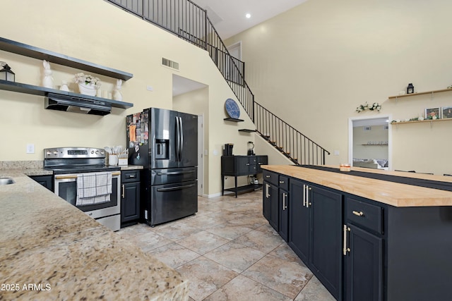 kitchen with open shelves, under cabinet range hood, black refrigerator with ice dispenser, and electric stove