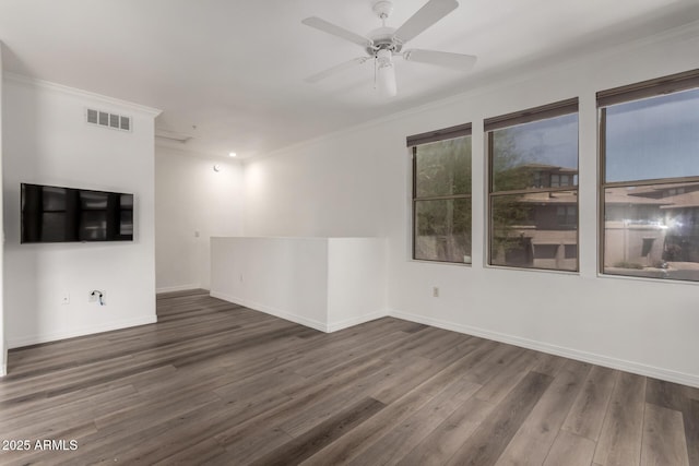 19777 N 76th St Unit 2244, Scottsdale, AZ 85255 - empty room featuring wood finished floors, ornamental molding, ceiling fan, baseboards, and visible vents