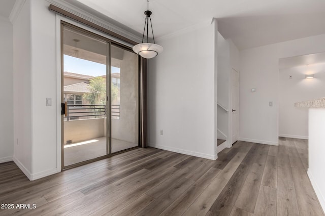19777 N 76th St Unit 2244, Scottsdale, AZ 85255 - unfurnished dining area with baseboards, wood finished floors, and ornamental molding