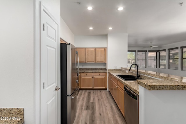 19777 N 76th St Unit 2244, Scottsdale, AZ 85255 - kitchen featuring a sink, stainless steel appliances, light wood-type flooring, recessed lighting, and a ceiling fan