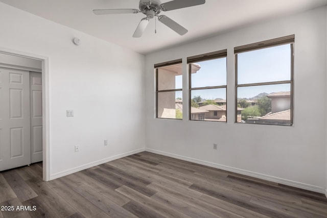 19777 N 76th St Unit 2244, Scottsdale, AZ 85255 - spare room with ceiling fan, baseboards, and dark wood finished floors
