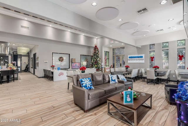 19777 N 76th St Unit 2244, Scottsdale, AZ 85255 - living room featuring visible vents, wood finished floors, and recessed lighting
