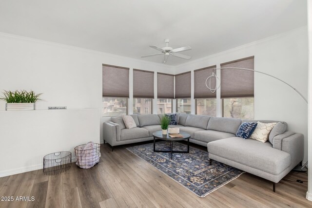 19777 N 76th St Unit 2244, Scottsdale, AZ 85255 - living area with crown molding, a ceiling fan, wood finished floors, and baseboards