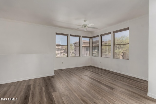 19777 N 76th St Unit 2244, Scottsdale, AZ 85255 - spare room featuring baseboards, wood finished floors, a ceiling fan, and ornamental molding