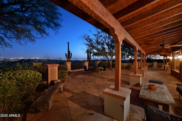 4885 N Via De La Granja, Tucson, AZ 85718 - patio terrace at dusk with a patio area, a ceiling fan, and outdoor dining area