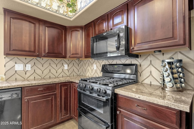 kitchen with black appliances, decorative backsplash, and light stone countertops