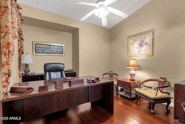office featuring a ceiling fan, wood finished floors, and vaulted ceiling