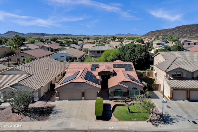 aerial perspective of suburban area with a mountainous background