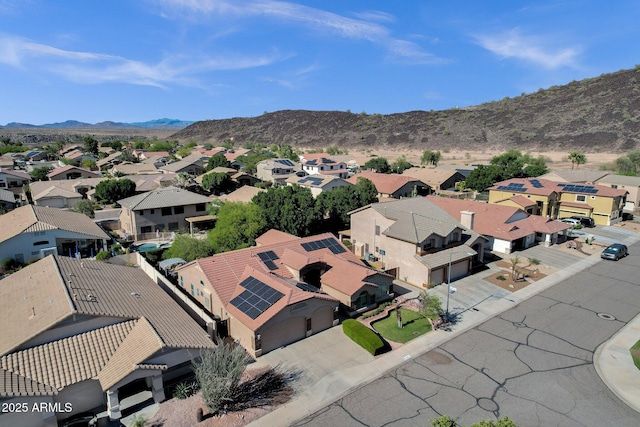 aerial perspective of suburban area with a mountain backdrop