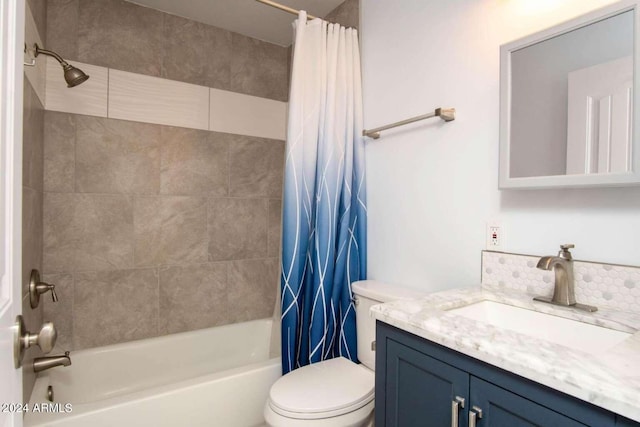 full bathroom featuring vanity, toilet, and shower / bathtub combination with curtain