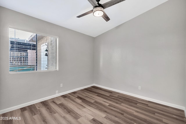 unfurnished room with ceiling fan and wood-type flooring