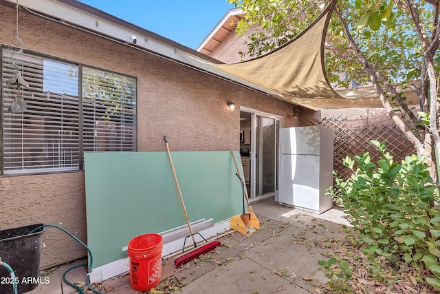 view of property exterior featuring a patio area