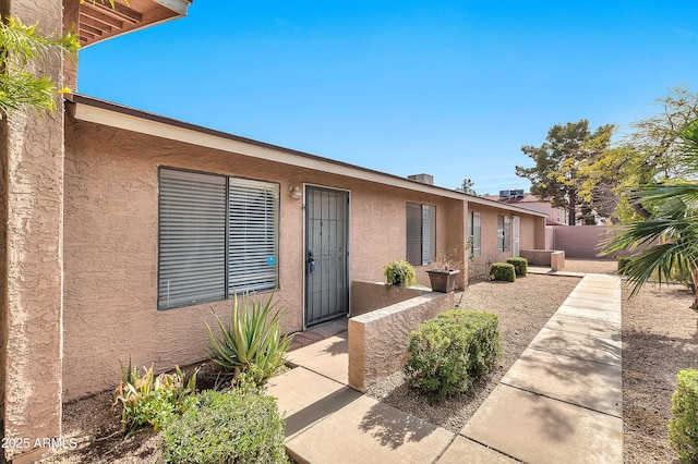 doorway to property featuring a patio area