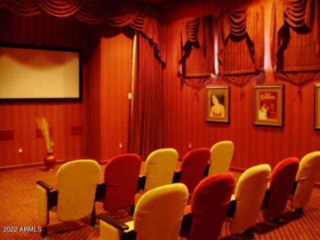 cinema room featuring carpet flooring