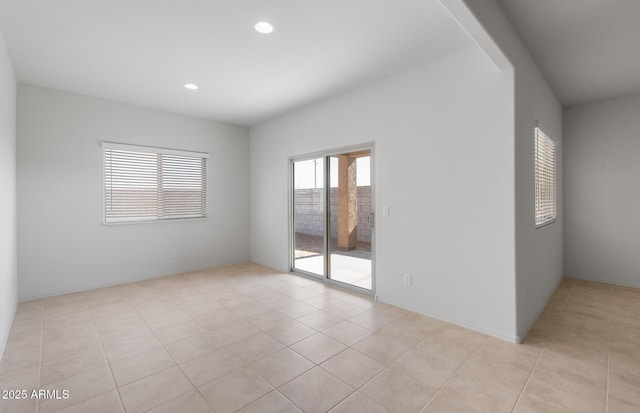 spare room with light tile patterned floors and recessed lighting