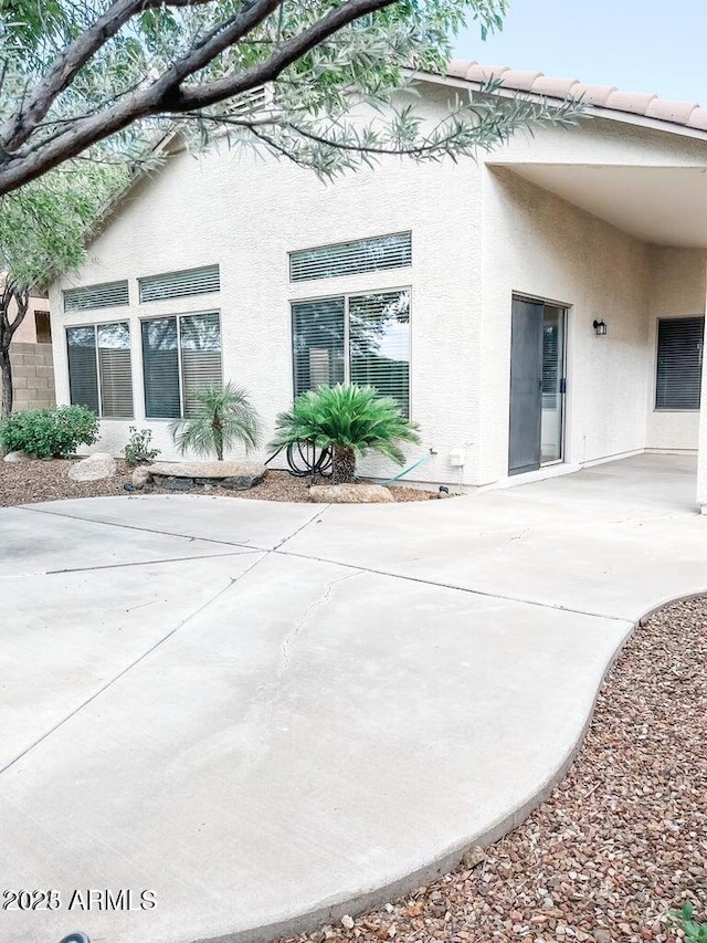40618 N Apollo Way, Anthem, AZ 85086 - back of house featuring a patio area and stucco siding