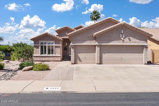 view of front of property with a garage