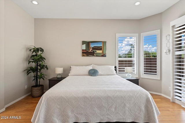 bedroom with wood-type flooring