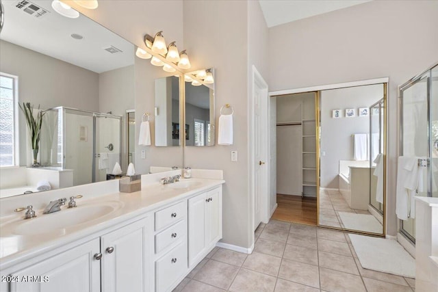 bathroom featuring vanity, tile patterned floors, and independent shower and bath