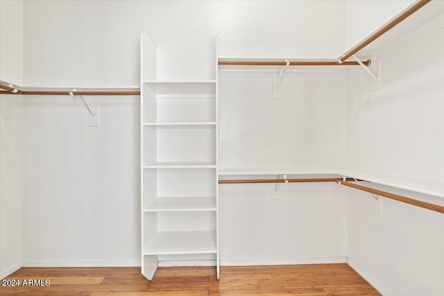 walk in closet featuring light hardwood / wood-style floors