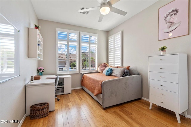 bedroom with light wood-type flooring and ceiling fan