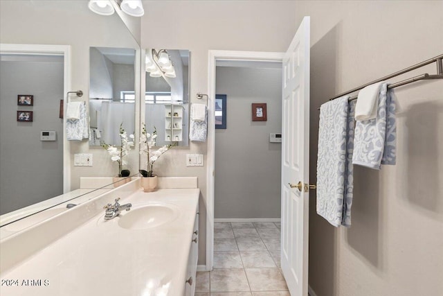 bathroom with tile patterned flooring and vanity