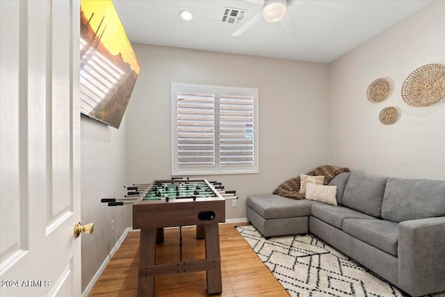 game room featuring hardwood / wood-style floors and ceiling fan