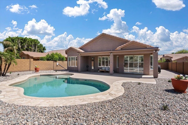 view of swimming pool featuring a patio area