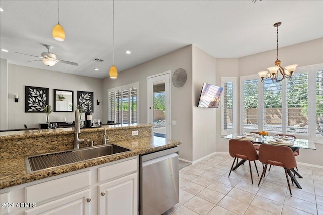 kitchen featuring dishwasher, white cabinetry, a wealth of natural light, and sink