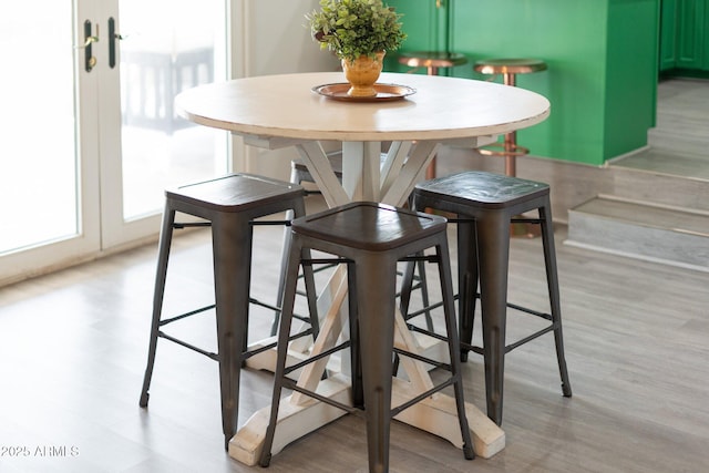 dining space with light wood-type flooring