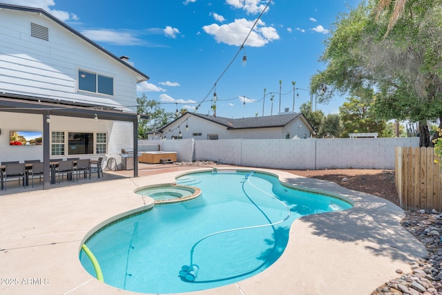 view of pool featuring an outdoor hot tub and a patio