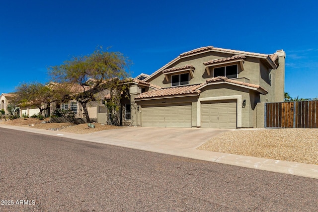16047 S 14th Dr, Phoenix, AZ 85045 - mediterranean / spanish house with driveway, fence, a garage, a tile roof, and stucco siding