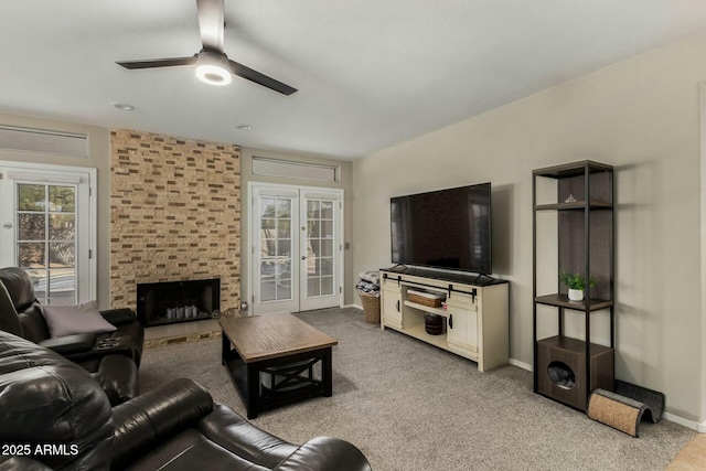 16047 S 14th Dr, Phoenix, AZ 85045 - carpeted living room with a brick fireplace, baseboards, and ceiling fan