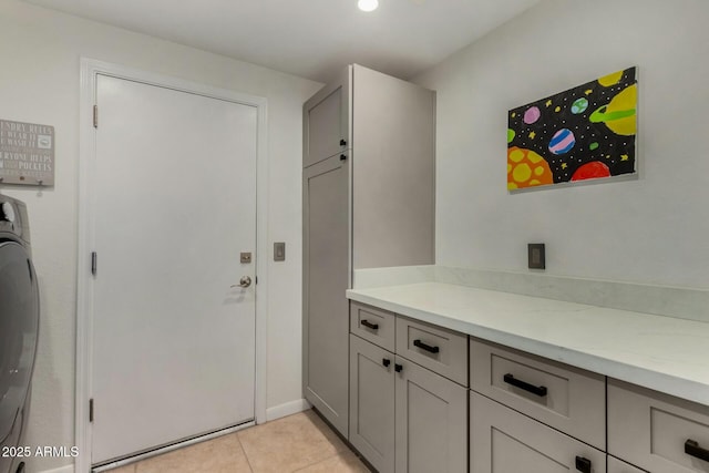 16047 S 14th Dr, Phoenix, AZ 85045 - interior space featuring light tile patterned flooring, cabinet space, and washer / clothes dryer