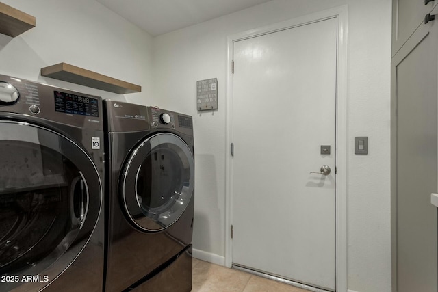 16047 S 14th Dr, Phoenix, AZ 85045 - laundry room featuring independent washer and dryer, laundry area, and light tile patterned floors