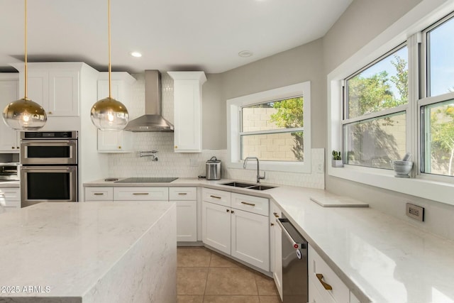 16047 S 14th Dr, Phoenix, AZ 85045 - kitchen featuring stainless steel appliances, a sink, pendant lighting, wall chimney range hood, and backsplash