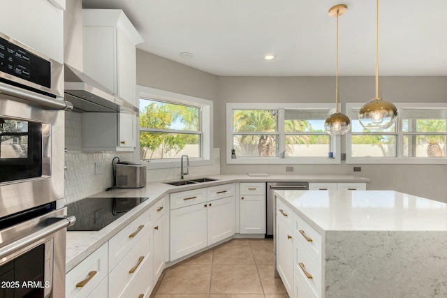 16047 S 14th Dr, Phoenix, AZ 85045 - kitchen with white cabinetry, tasteful backsplash, light tile patterned floors, a sink, and appliances with stainless steel finishes