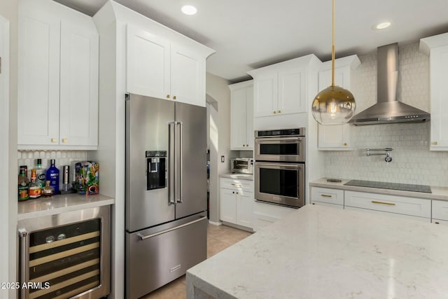 16047 S 14th Dr, Phoenix, AZ 85045 - kitchen with wall chimney range hood, tasteful backsplash, wine cooler, and stainless steel appliances