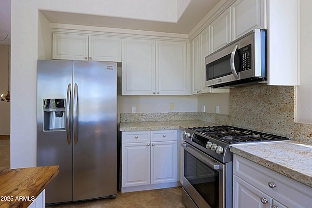 32710 N 71st St, Scottsdale, AZ 85266 - kitchen with appliances with stainless steel finishes, white cabinets, and backsplash