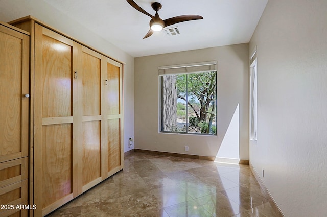 32710 N 71st St, Scottsdale, AZ 85266 - unfurnished bedroom featuring baseboards and a ceiling fan