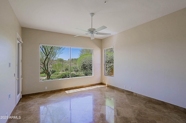 32710 N 71st St, Scottsdale, AZ 85266 - empty room with ceiling fan and marble finish flooring