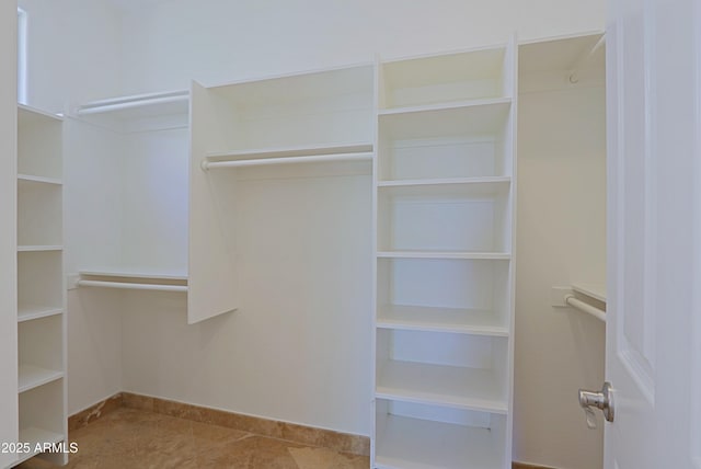 32710 N 71st St, Scottsdale, AZ 85266 - spacious closet featuring tile patterned flooring
