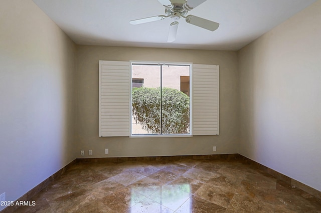 32710 N 71st St, Scottsdale, AZ 85266 - empty room with stone finish flooring and ceiling fan