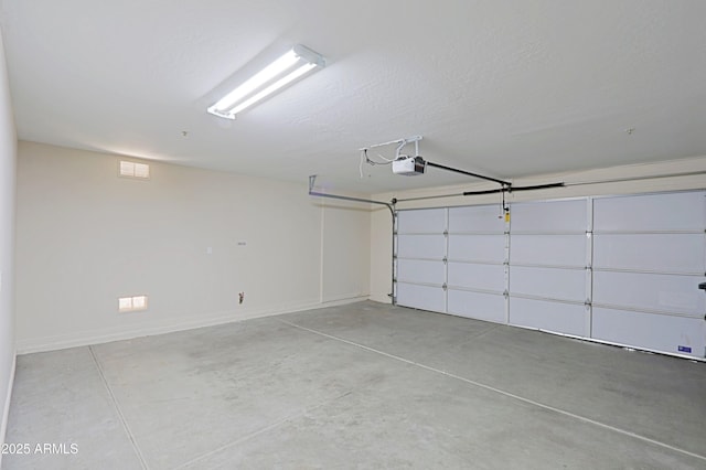 32710 N 71st St, Scottsdale, AZ 85266 - garage featuring baseboards and a garage door opener
