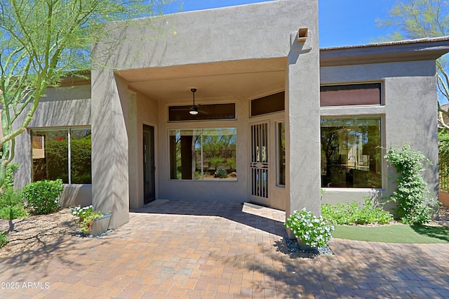 32710 N 71st St, Scottsdale, AZ 85266 - doorway to property with stucco siding, a patio, and ceiling fan