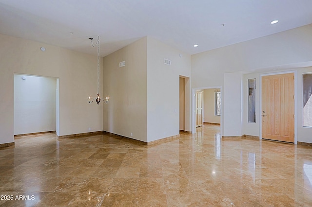 32710 N 71st St, Scottsdale, AZ 85266 - unfurnished room featuring a chandelier, marble tiled flooring, and a high ceiling